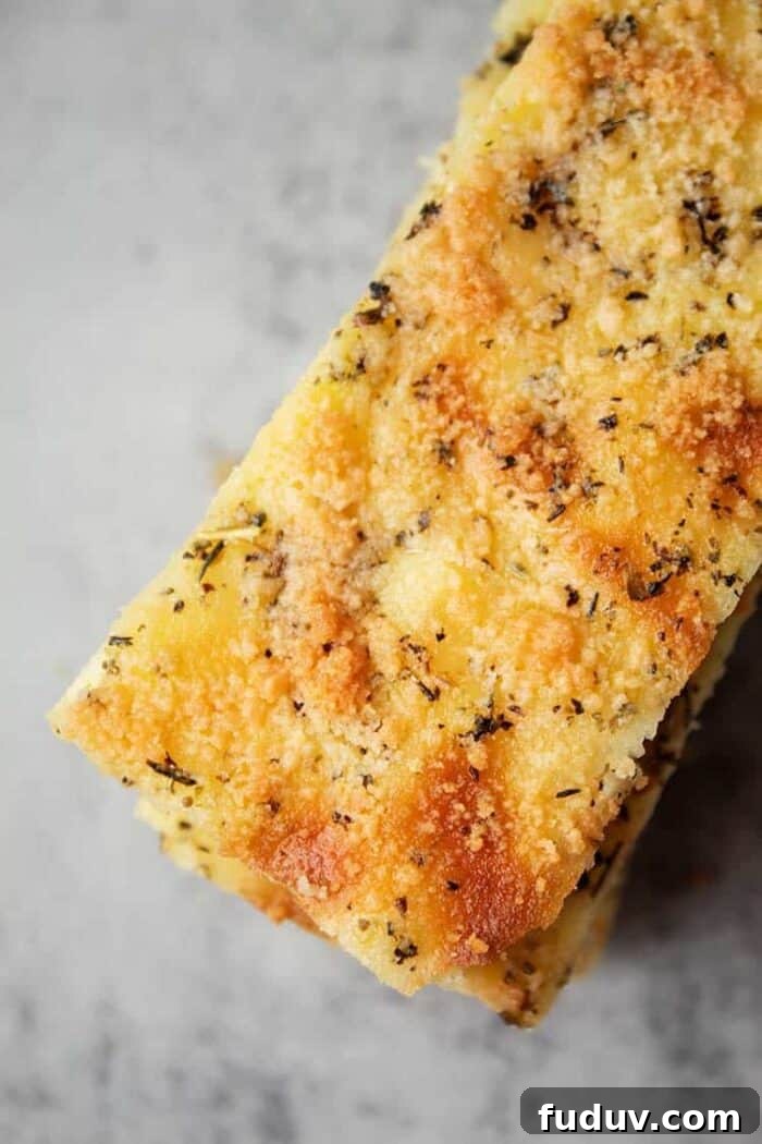 keto garlic bread stacked in a narrow pile