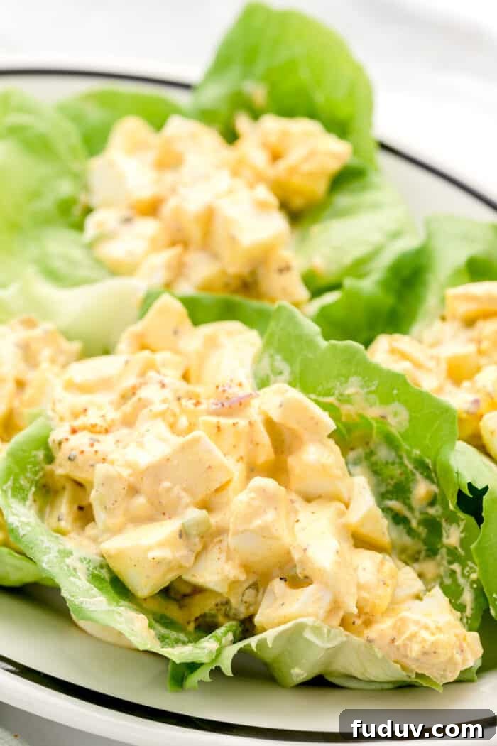 plate with low carb egg salad stuffed in lettuce wraps