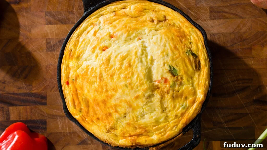 Protein-Packed Baked Eggs with Cottage Cheese 6 Baked cottage cheese eggs in a large cast iron pan.
