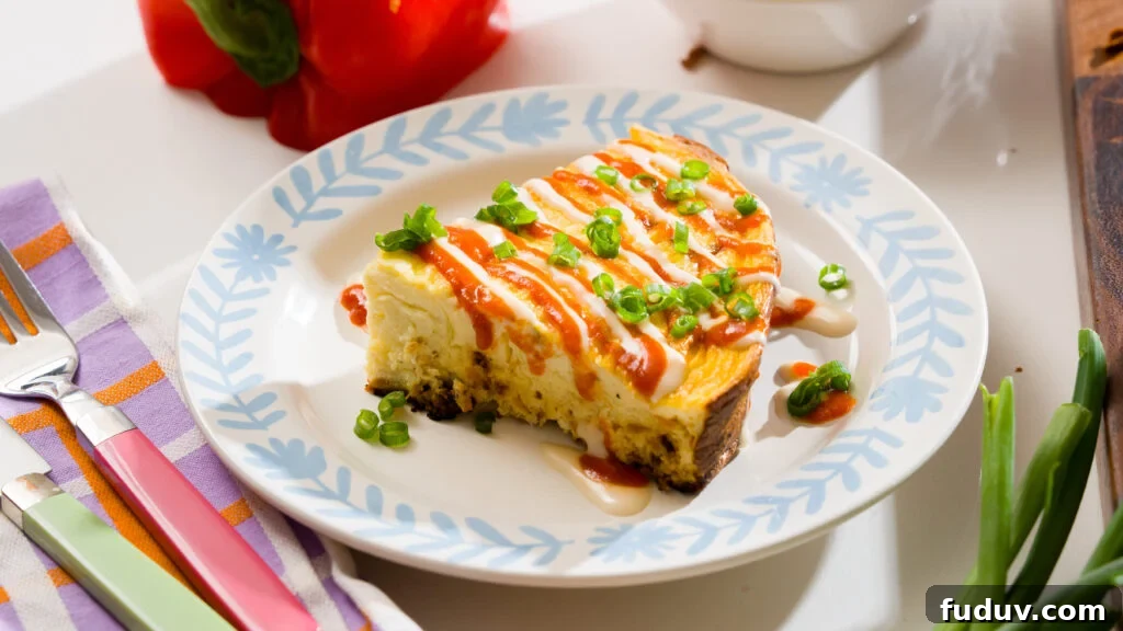 Protein-Packed Baked Eggs with Cottage Cheese 8 Baked cottage cheese egg slice on a plate, drizzled with sriracha and green onions.