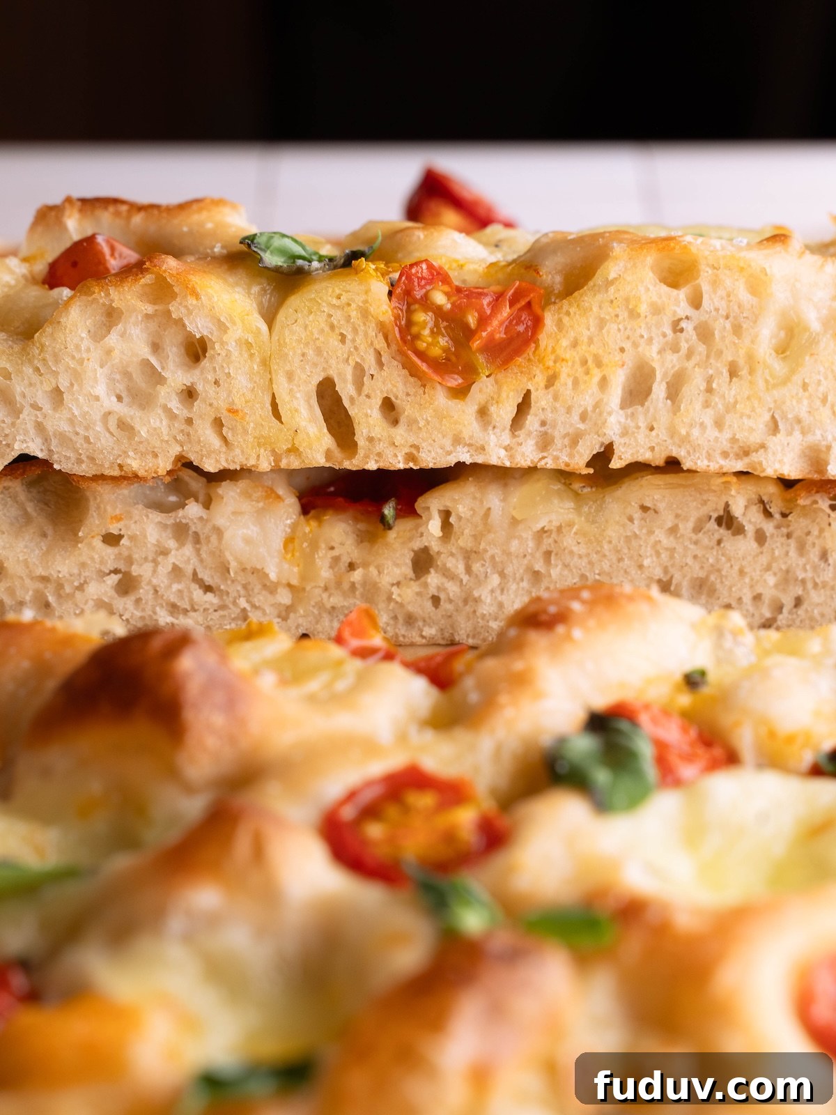 Layers of Caprese focaccia stacked on top of each other