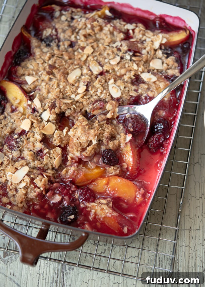 Nectarine and blackberry are baked together with crunchy oat topping 