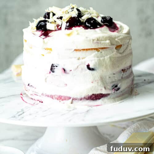 white forest cake on a cake stand