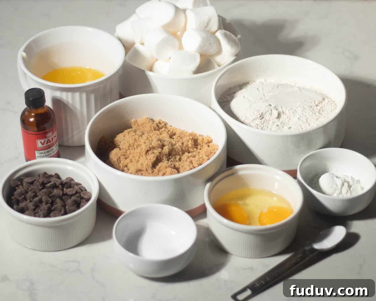Chewy Chocolate Chip and Gooey Marshmallow Cookies 5 Ingredients for chocolate chip marshmallow cookies, including brown sugar, marshmallows, chocolate chips, flour, eggs, vanilla extract, and baking soda arranged in separate bowls on a counter.