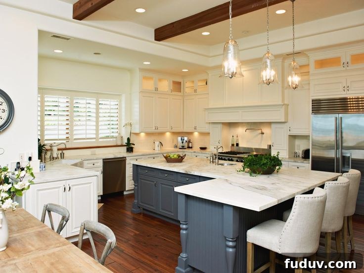 25+ Stunning All-White Kitchen Designs for Timeless Style 22 Transitional Kitchen With Blue Island | 25+ Dreamy White Kitchens