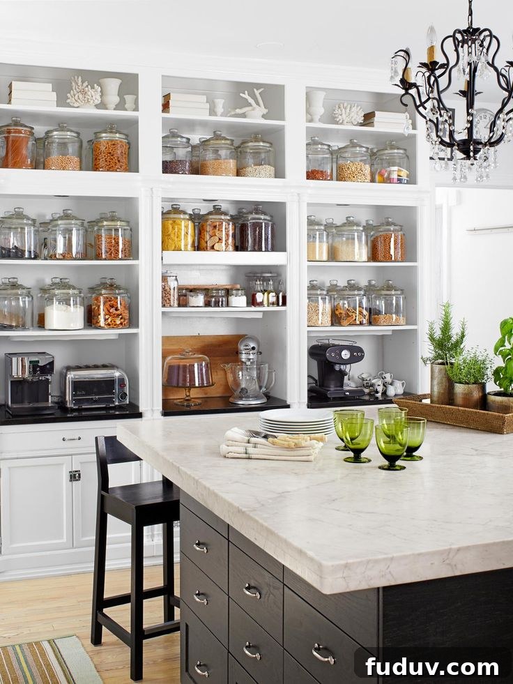 25+ Stunning All-White Kitchen Designs for Timeless Style 26 Storage on Display in an Organized Kitchen With Island | 25+ Dreamy White Kitchens