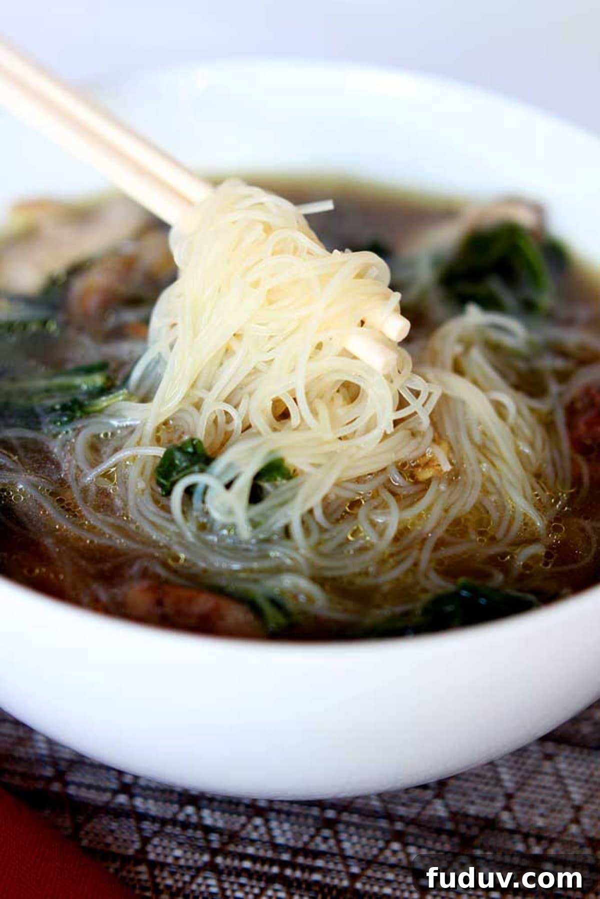 Bowl of Asian chicken noodle soup.