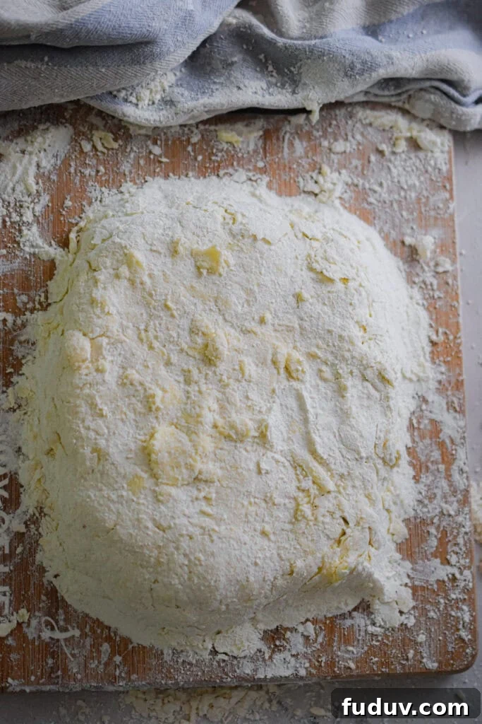 The dough is on a cutting board.