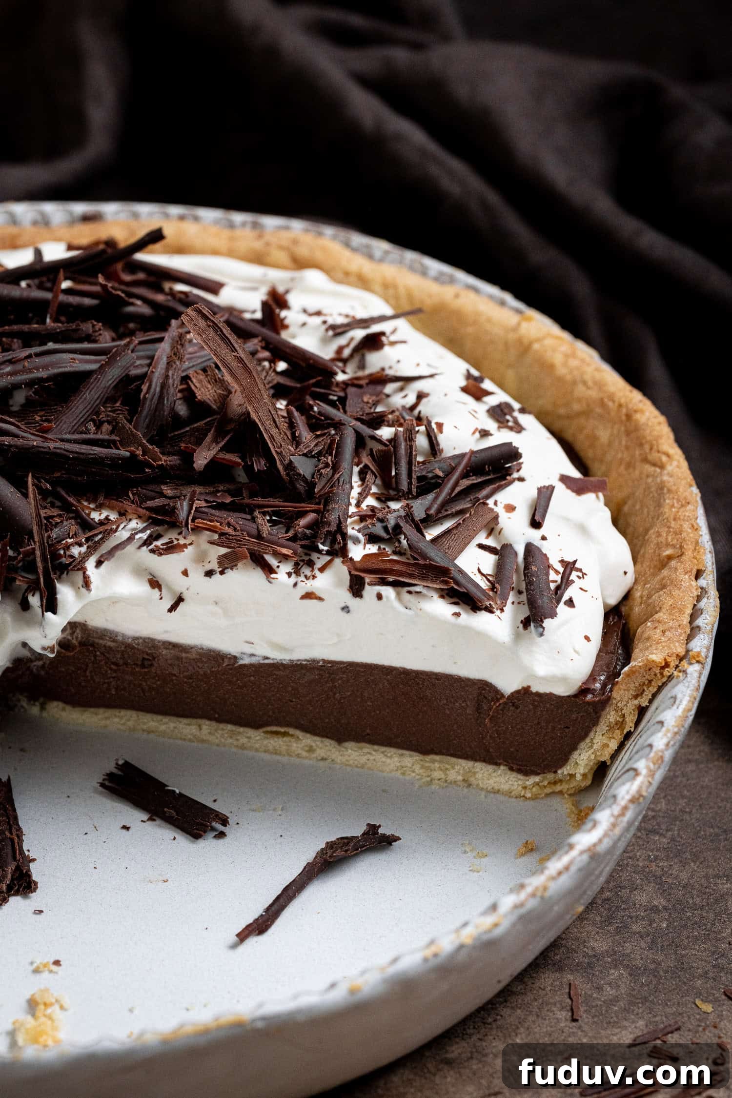 Close up shot of the sliced pie in the pie dish.