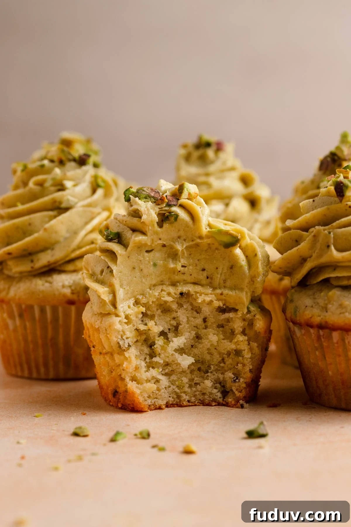 Pistachio cupcake topped with pistachio butter cream.