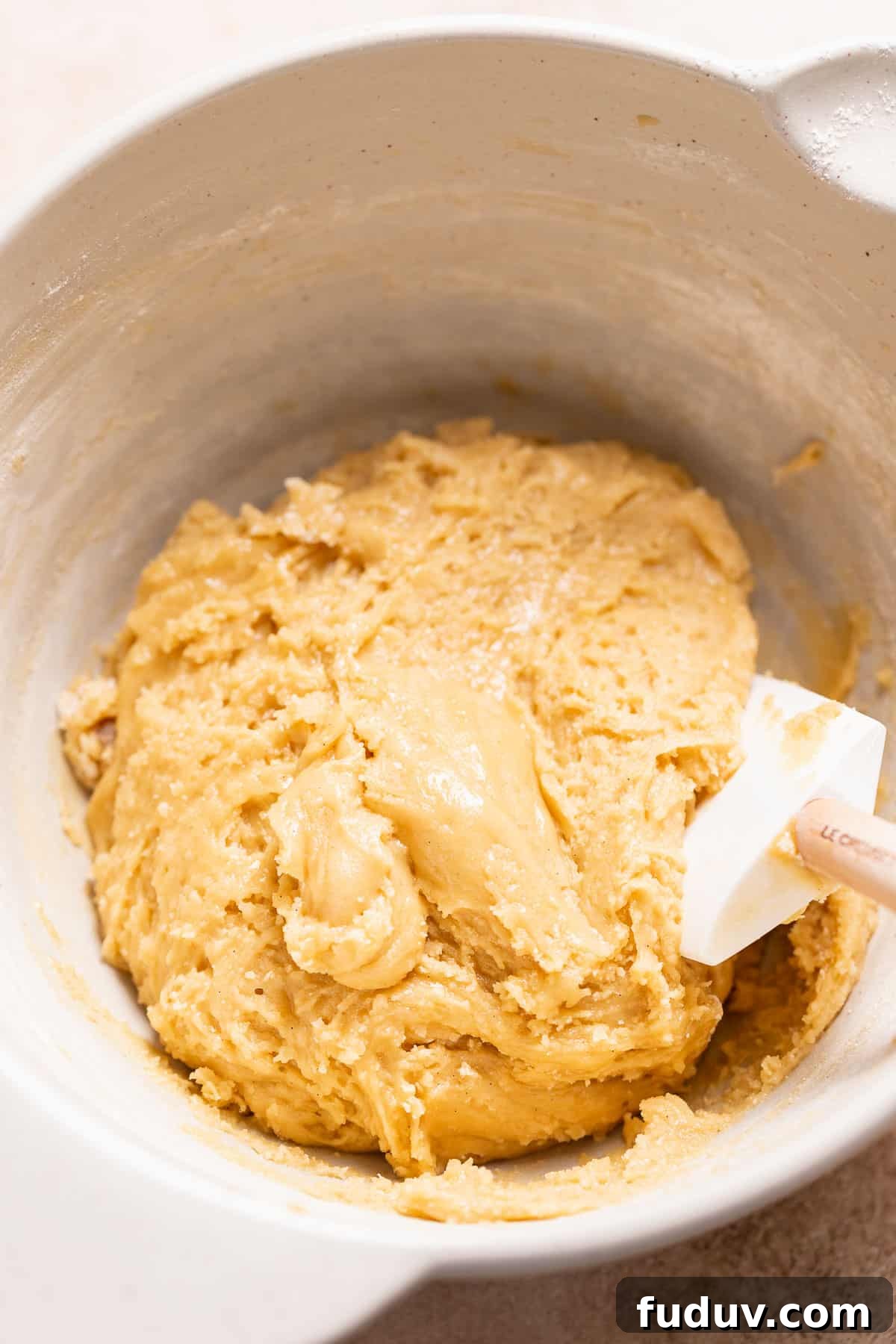 A mixing bowl with the finished cookie dough.