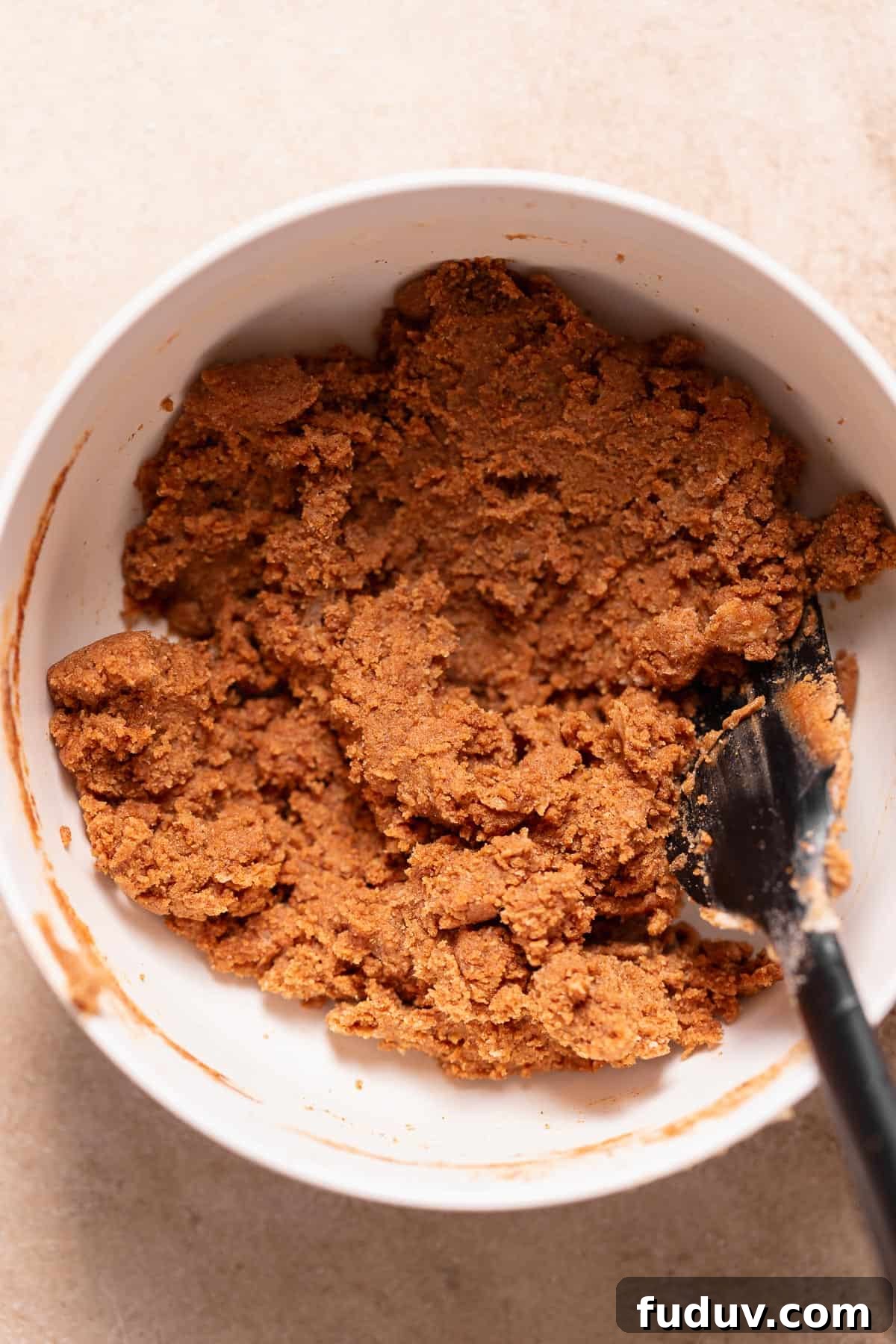 A white bowl with the cinnamon sugar filling.