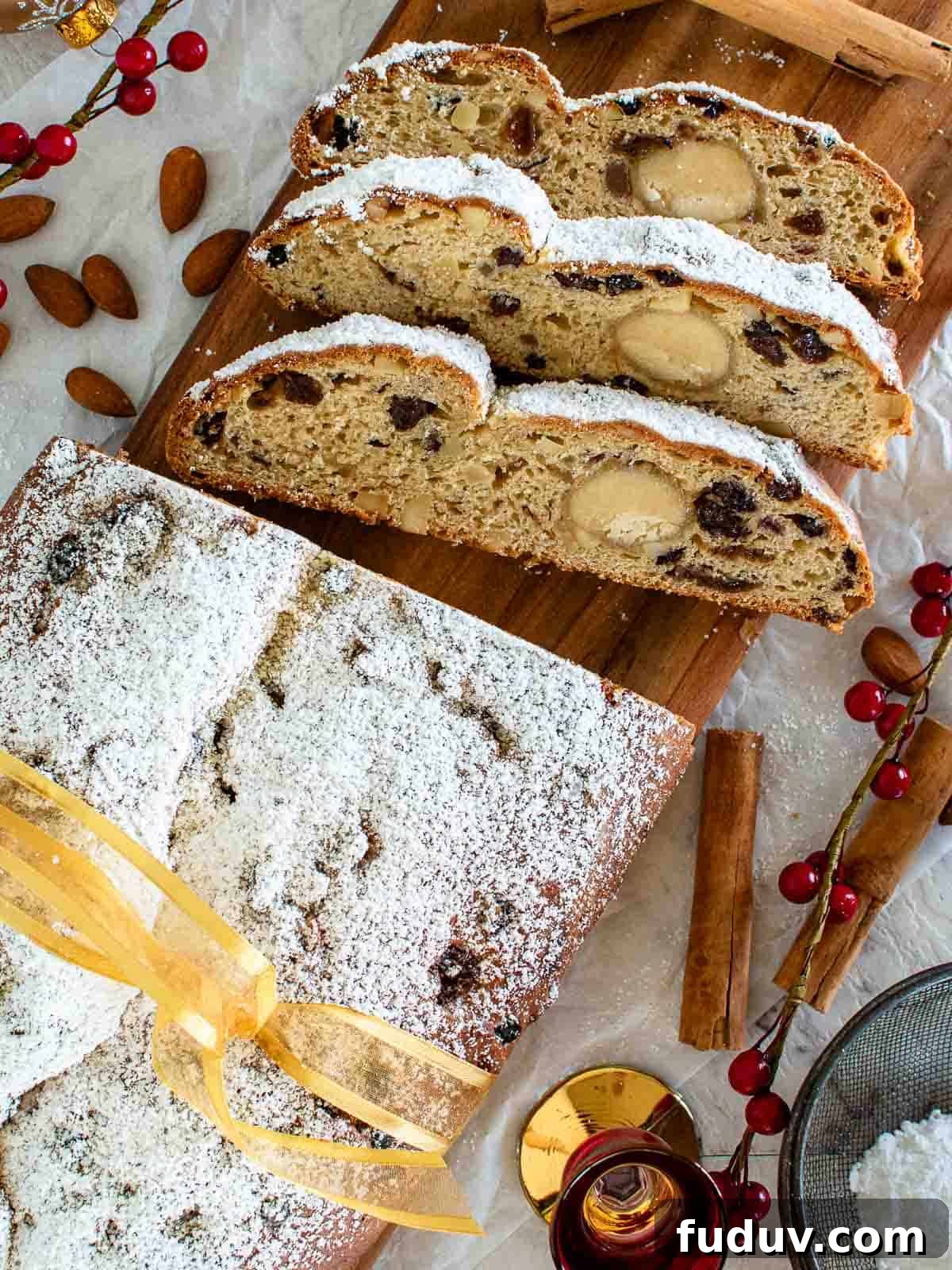 Traditional German Stollen Recipe: Classic Holiday Fruit Bread 2 Stollen Bread viewed from above with three slices cut.