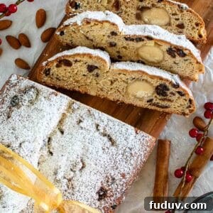 Traditional German Stollen Recipe: Classic Holiday Fruit Bread 12 Stollen Bread viewed from above with three slices cut.