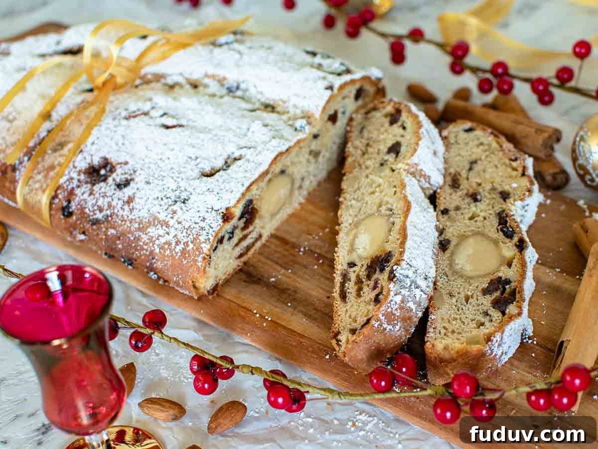 Traditional German Stollen Recipe: Classic Holiday Fruit Bread 10 Christmas stollen on a wooden board with three slices cut.