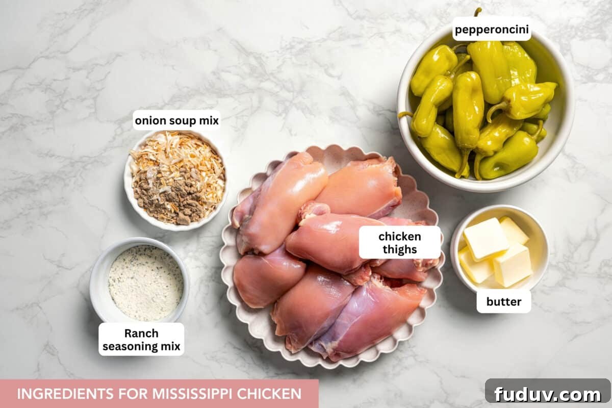 Mississippi chicken is an easy crock pot recipe with juicy chicken shredded in savory pepperoncini ranch sauce. Make it with 5 ingredients! Ingredients for Mississippi chicken with text labels overlaying each ingredient.