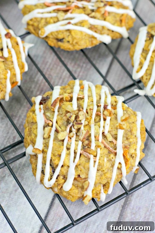 an overhead shot of carrot cake cookies on a wire metal rack.