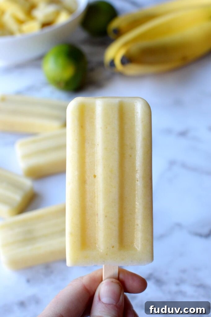 A close up of a pineapple popsicle
