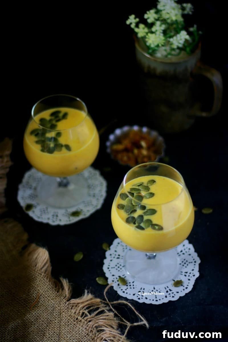 pumpkin custard or kaddu ki kheer served in a glass with pumpkin seeds shot in a straight on mode.