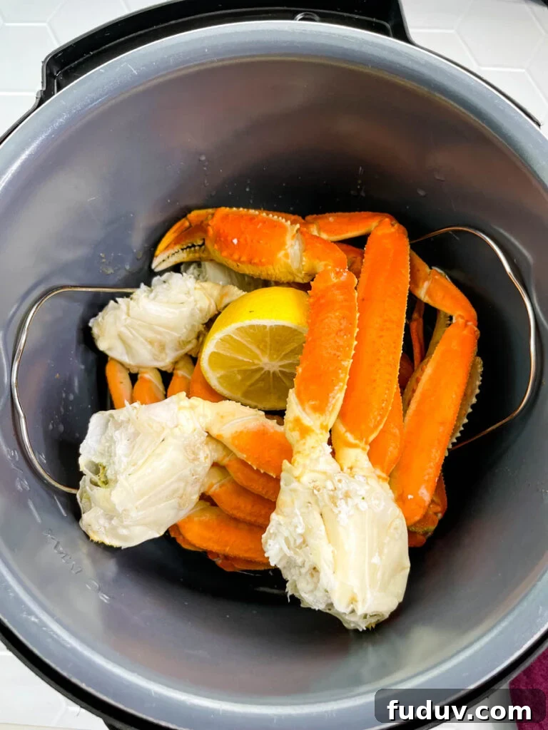 crab legs in an Instant Pot with fresh lemon