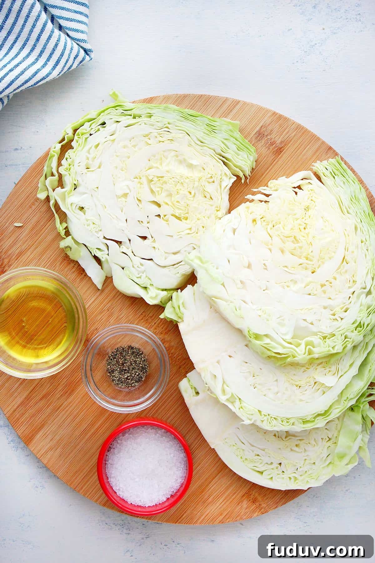 Roasted Cabbage ingredients Ingredients on a round cutting board.