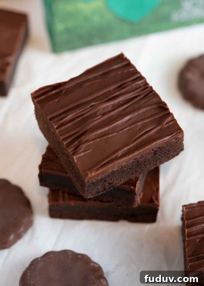 Thin Mint Cookie Bars Recipe with Chocolate Ganache 13 stack of chocolate thin mint square bars with chocolate drizzle