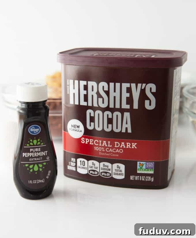 Thin Mint Cookie Bars Recipe with Chocolate Ganache 4 container of hershey's dark cocoa powder and bottle of peppermint extract