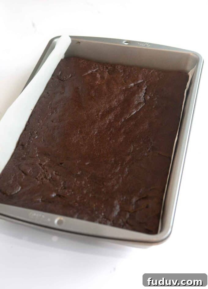 Thin Mint Cookie Bars Recipe with Chocolate Ganache 7 baked chocolate cookie dough pressed into 9x13 metal pan