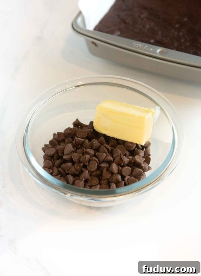 Thin Mint Cookie Bars Recipe with Chocolate Ganache 8 glass bowl with chocolate chips and half stick of butter