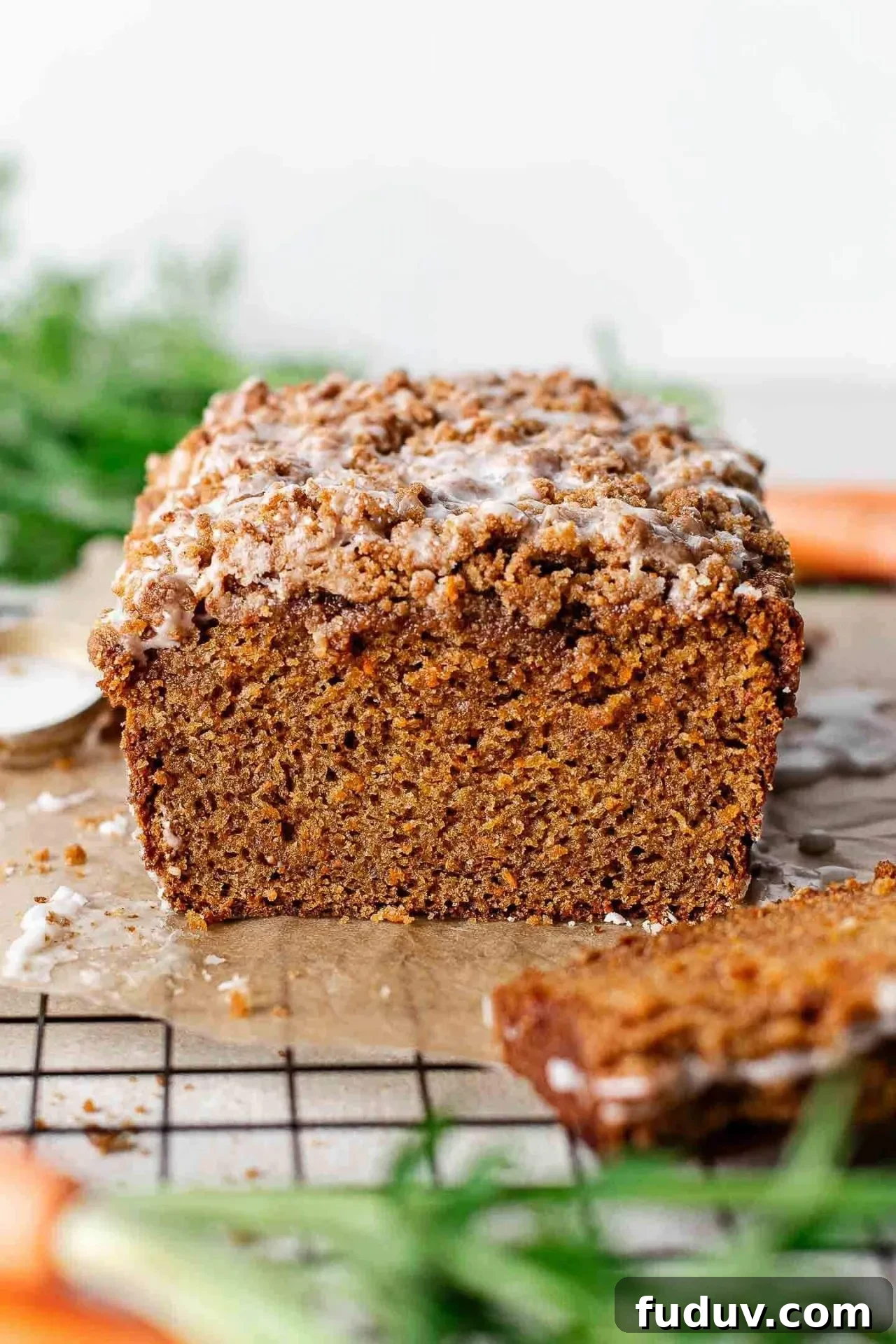 sliced carrot bread on parchment lined wire rack