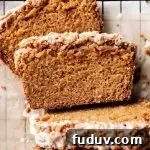 sliced carrot bread on parchment lined wire rack