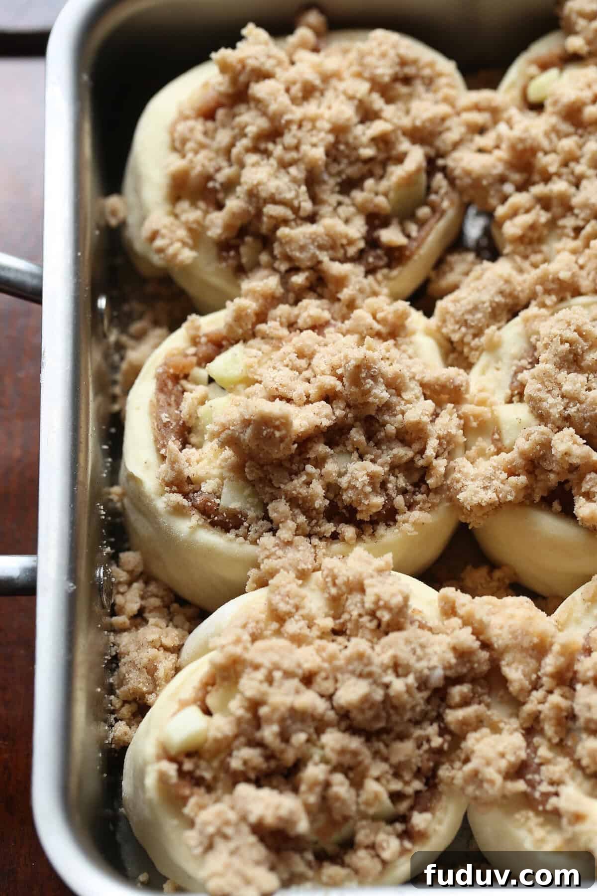 Apple Crumb Cinnamon Rolls are soft, delicious cinnamon rolls filled with diced apples and topped with crumb topping. It’s the perfect mash-up of two classic breakfast sweets, crumb cake and cinnamon rolls! Apple Crumb Cinnamon Rolls