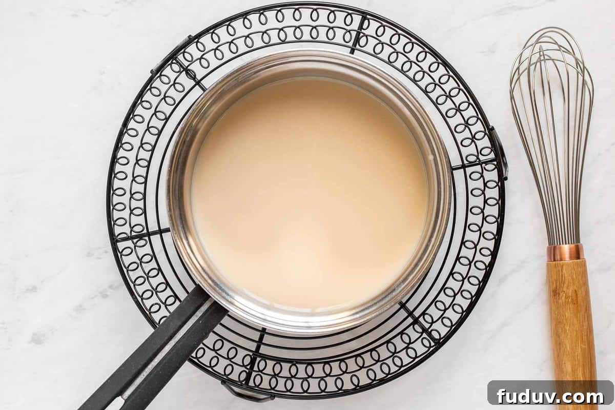 How to Make a Rich Caramel Latte at Home in Minutes 4 Caramel and milk in saucepan.