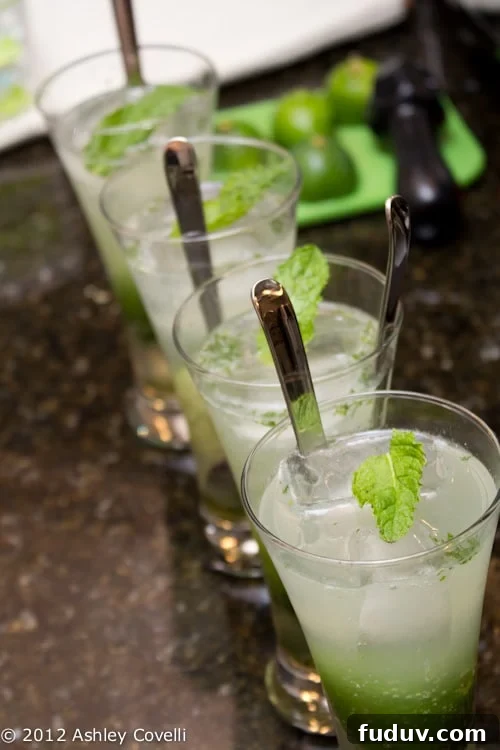 Glasses of mojitos garnished with fresh mint.