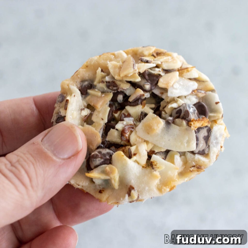 hand holding one of the 4 ingredient almond joy cookies