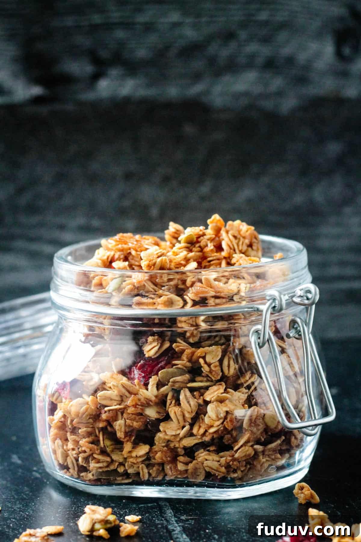Vegan Pumpkin Spice Granola Recipe for Fall Breakfasts 12 Front view of a jar of crunchy granola.