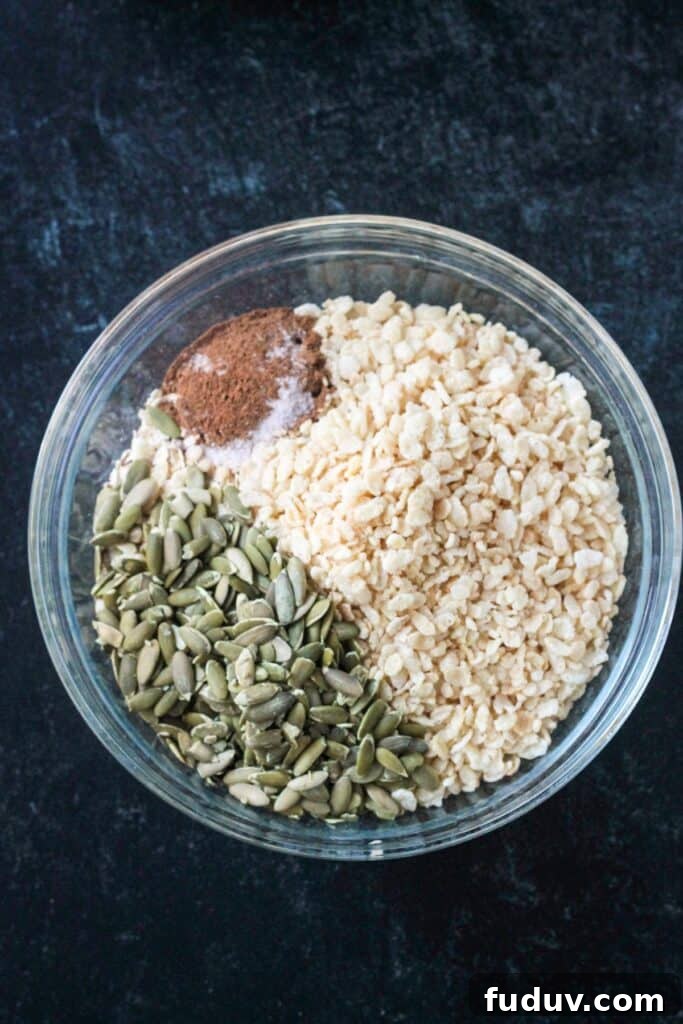 Vegan Pumpkin Spice Granola Recipe for Fall Breakfasts 4 Dry ingredients in a mixing bowl.