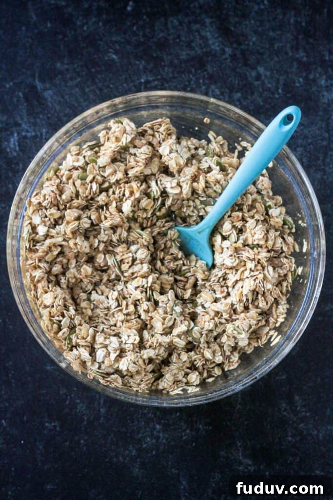 Vegan Pumpkin Spice Granola Recipe for Fall Breakfasts 6 Dry ingredients mixed with maple syrup and vanilla.