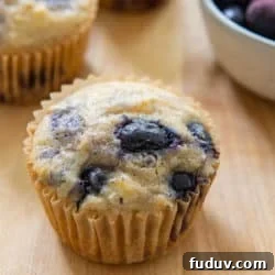 Sourdough Discard Blueberry Muffins on a Cutting Board