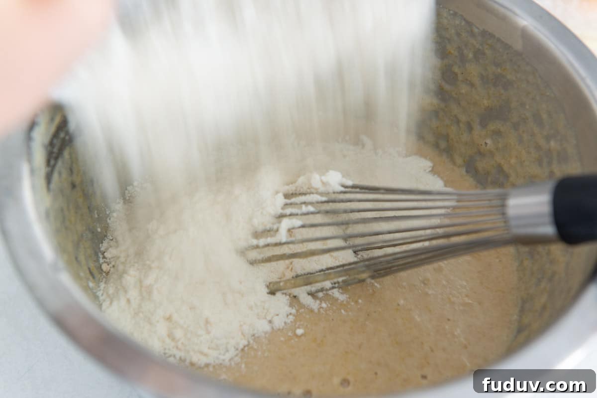 Pouring the dry ingredients into the wet ingredients