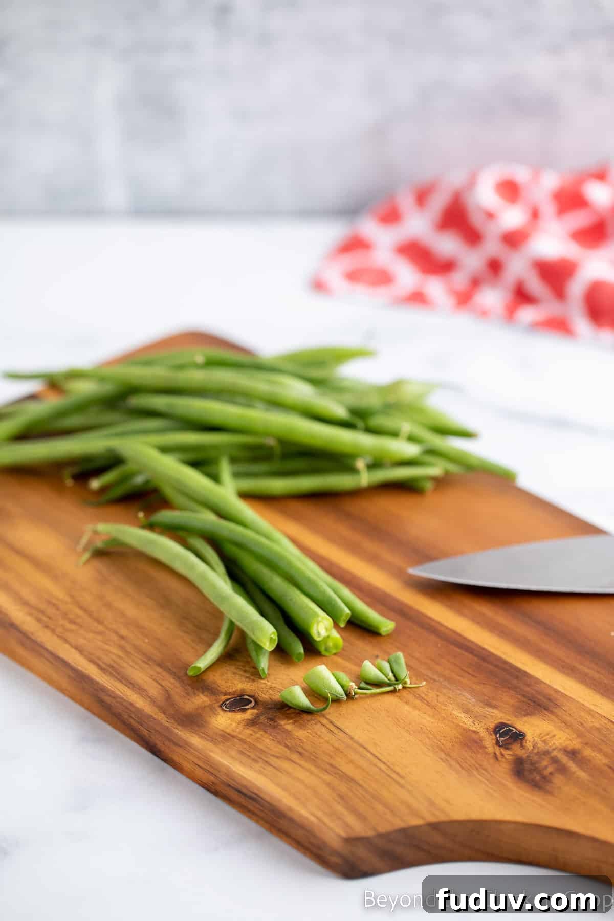 Trimming the ends off of green beans.