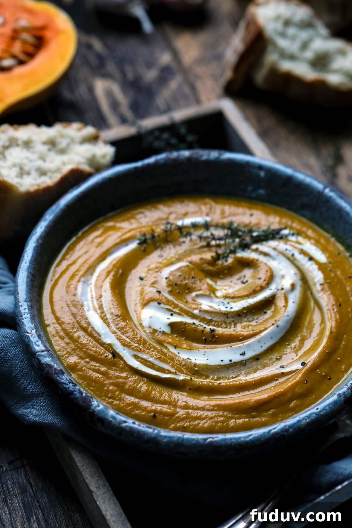Vegan Butternut Squash Soup Garnished with Thyme.