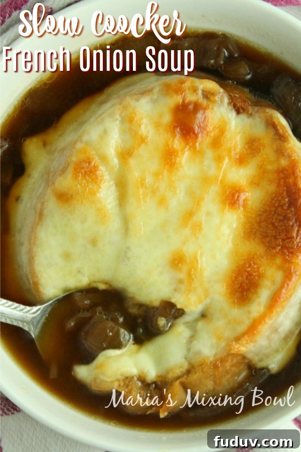 Slow Cooker French Onion Soup Slow cooker French onion soup in white bowl with spoon