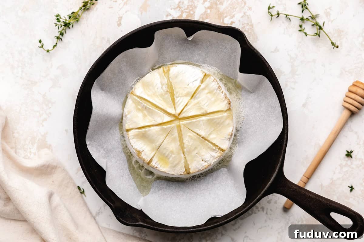Baked brie cheese in a pan.