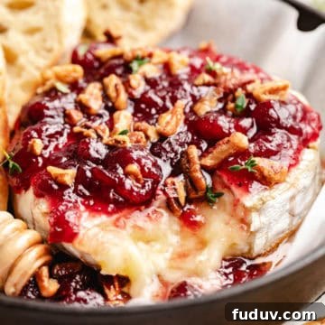 Close up view of baked with cranberry sauce and pecans.