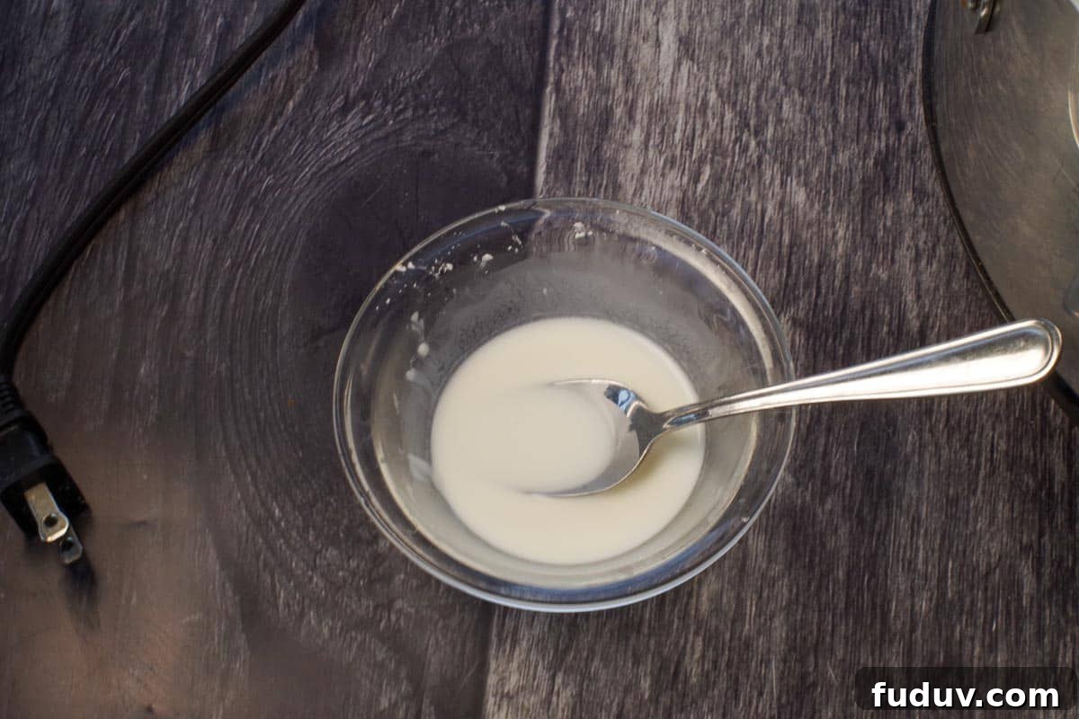 cornstarch mixed with cold water to make a slurry in a small glass bowl