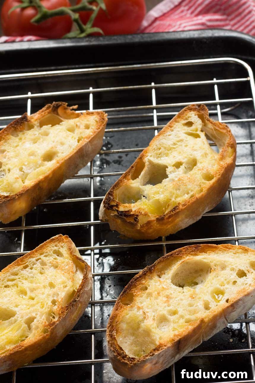 Pan con Tomate: Classic Spanish Tomato Toast Recipe 3 Grilled bread for pan con tomate on a grill from above