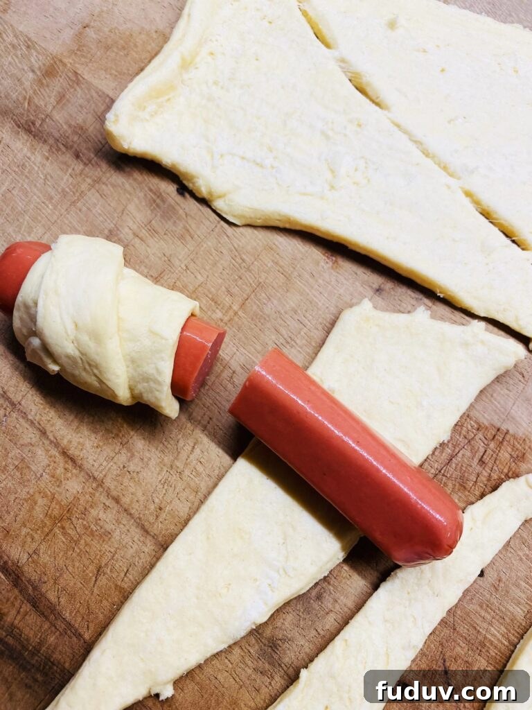 Crispy Air Fryer Pigs in a Blanket Recipe 5 rolling hot dog half in crescent roll dough