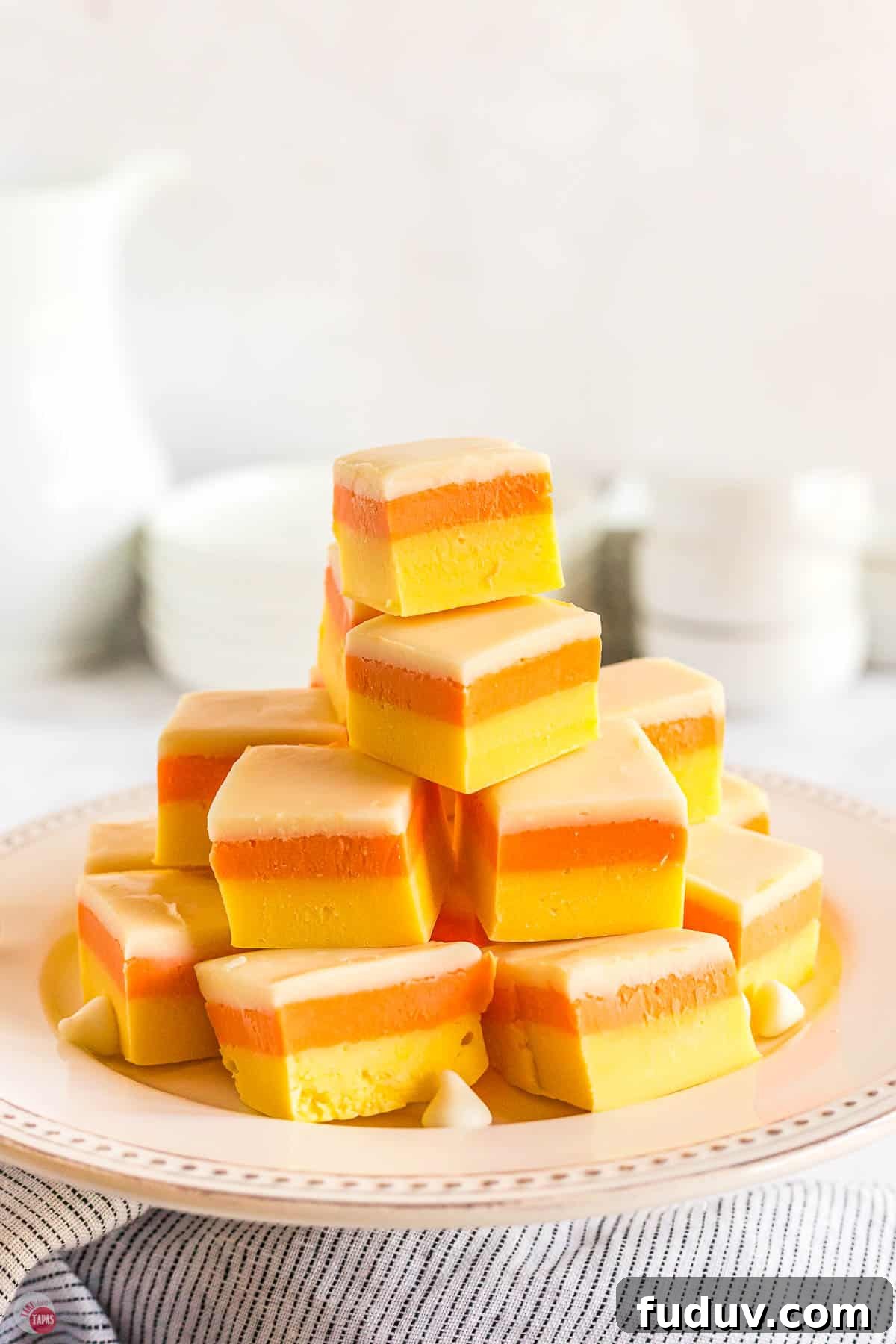 Candy Corn Fudge Recipe: Creamy Halloween Candy Treat 2 stack of fudge on white platter