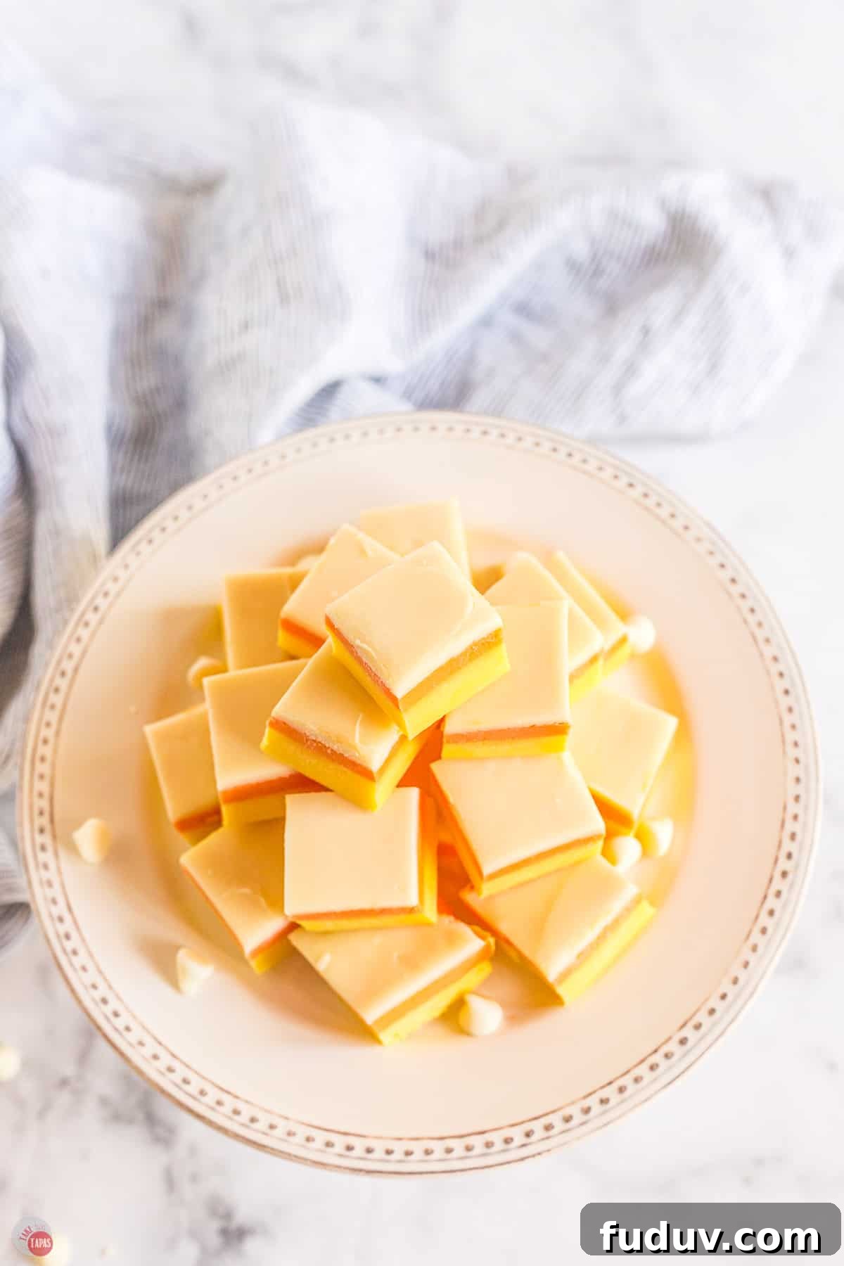 Candy Corn Fudge Recipe: Creamy Halloween Candy Treat 12 stack of candy corn fudge on a white platter
